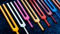 Colorful tuning forks on blue textile - PhotoDune Item for Sale