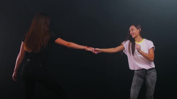 Two Young Women Dancing and Having Fun