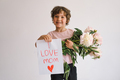 Happy Mothers Day. Cheerful happy child with Peonys bouquet. - PhotoDune Item for Sale