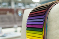 Catalog of multi-colored fabric samples. Textile industry background. - PhotoDune Item for Sale