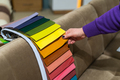 A women looks at tissue samples. Selects the color of the sofa. - PhotoDune Item for Sale