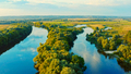 Aerial view above a beautiful landscape with a  river while sunset. drone over a summer landscape. - PhotoDune Item for Sale
