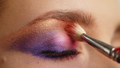 Make-up artist applies makeup to the upper eyelid, close-up. Makeup artist applies a bright shado - PhotoDune Item for Sale