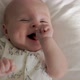 Baby Lies on Her Back and Smiles - VideoHive Item for Sale