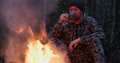 Man with cup of tea the fire in the forest. Human looks at the bonfire and drinks tea on nature.  - PhotoDune Item for Sale