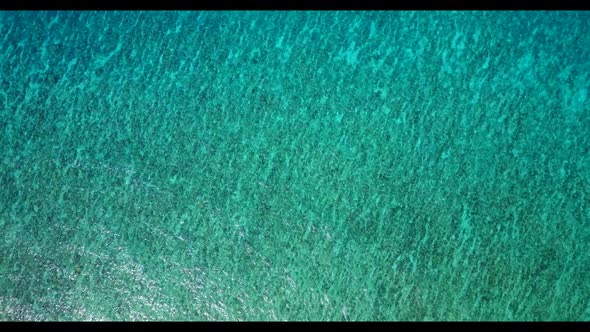 Aerial drone shot sky of tropical resort beach adventure by aqua blue water with white sand backgrou