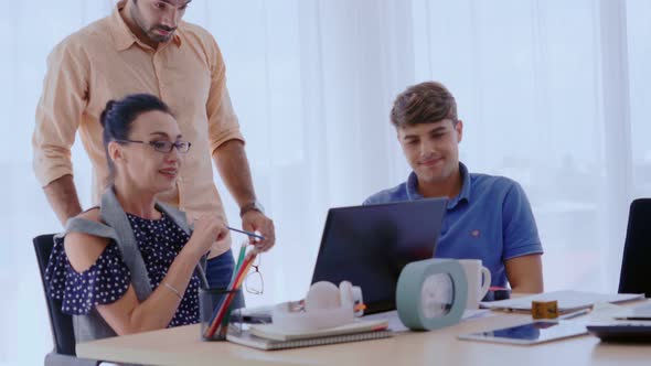 Group Meeting of Creative Business People Designer and Artist at Office Desk