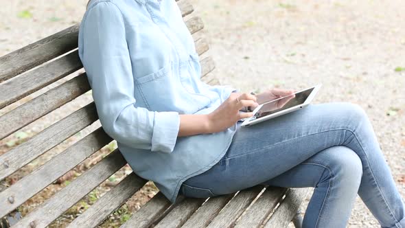 Young Woman Using Digital Tablet Outdoor