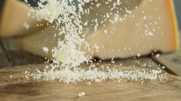 Super Slow Motion Shot of Grated Parmesan Falling on Wooden Board at 1000 Fps