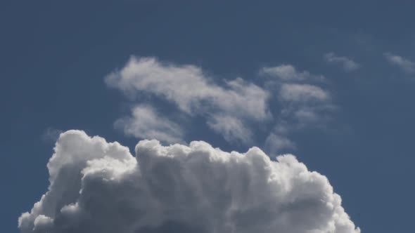 Clouds Avanzing in the Blue Sky