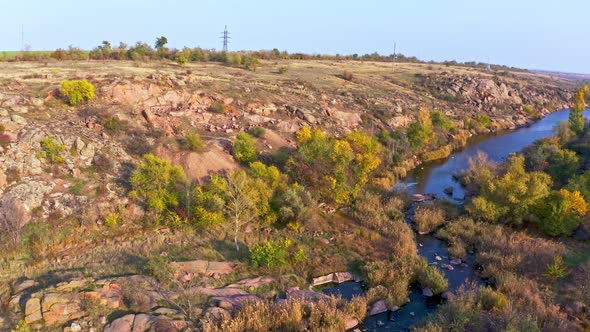 A Smooth Shining Stream Flows Among Large Boulders