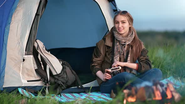 Smiling Tourist Woman Posing at Camping Tent Background