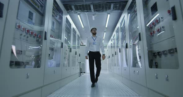 Electrical Worker Walking Down the Hall