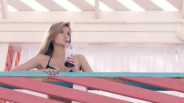 Hot Girl on Summer Beach, Drinking Cold Cocktail with Ice.