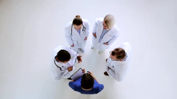 Group of Doctors Discussing Cardiogram at Hospital 