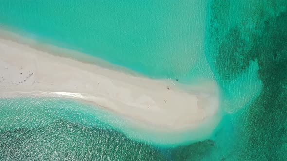 Luxury birds eye copy space shot of a white sandy paradise beach and turquoise sea background 