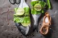 Preparing whole sea bream with horseradish leaves and lime. - PhotoDune Item for Sale