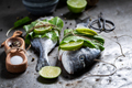 Seasoning freshl fish with salt, pepper and mint. - PhotoDune Item for Sale