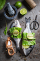 Preparing whole sea bream with salt, pepper and mint. - PhotoDune Item for Sale
