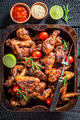 Hot roasted chicken leg served with sauces and lime. - PhotoDune Item for Sale