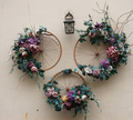 Decoration urban art object from bicycle wheels and flowers on wall - PhotoDune Item for Sale