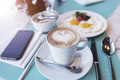 Coffee cup with mobile on table with breakfast. Relax time. Business connection technology. - PhotoDune Item for Sale