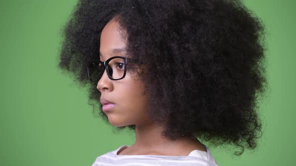 Profile View of Young Cute African Girl with Afro Hair