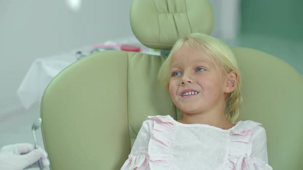 Girl Is Talking To the Doctor, Laughing and Smiling.