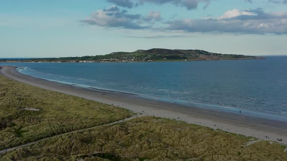 Howth peninsula on the horizon at golden hour.