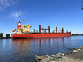 Cargo Ship makes its way up the Delta to the heading to the ocean - PhotoDune Item for Sale