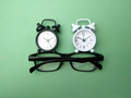 Black and white alarm clock and glasses - PhotoDune Item for Sale