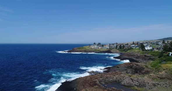 Drone aerial footage of waves crashing against the coastline on the south coast of Australia