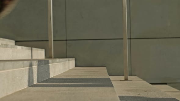 The Feet of Different People Rush Up the Stairs of an Underground Passage or Subway