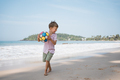 Little blond boy playing ball at the beach of sea cost at summer day - PhotoDune Item for Sale