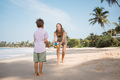 Happy young beautiful mother and son playing ball at beach in sunny day - PhotoDune Item for Sale