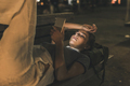 Young woman lying on bench at night using cell phone - PhotoDune Item for Sale