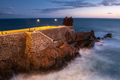 Rocks at Ponta do Sol, Madeira promenade on cliffs. Sunset light, Atlantic Ocean waves - PhotoDune Item for Sale