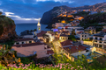 Cityscape of Camara de Lobos at dusk illuminated architecture of the seaside town in Madeira  - PhotoDune Item for Sale