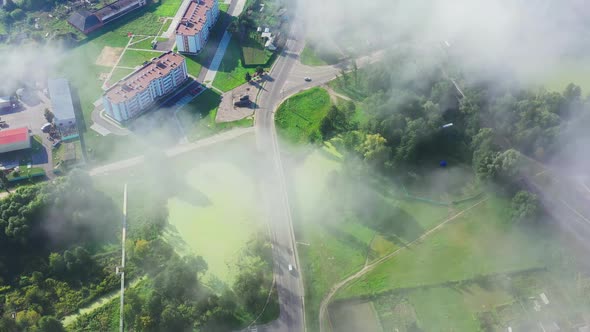 A Beautiful Green City in Europe Is Shrouded in Morning Fog. View From Above