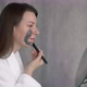 Young Woman Takes Care of Skin of Face - VideoHive Item for Sale