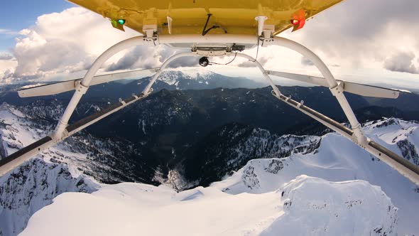 Aerial Helicopter Skids View Flyover Snowy Mountain Top Cascade Mountain Range Ridge Three Fingers