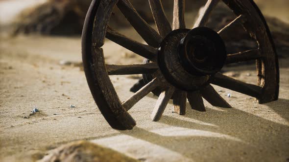 Large Wooden Wheel in the Sand