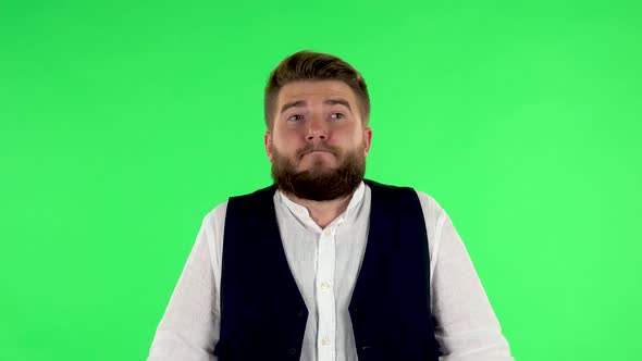 Upset Man Shrugs and Shakes His Head Negatively. Green Screen