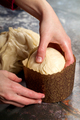 Confectioner lays the dough in form for baking Easter cakes - PhotoDune Item for Sale