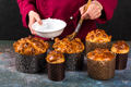 Pastry chef decorates freshly baked Easter cake with sugar syrup - PhotoDune Item for Sale