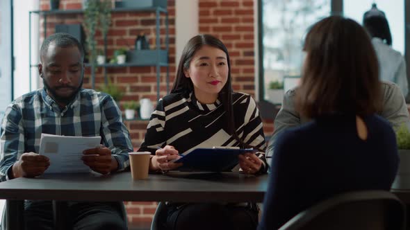 Diverse Group of Employees Talking to Applicant at Job Interview