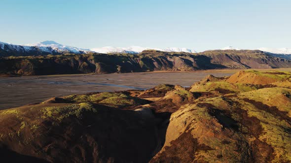 Drone Rising Over Hvannagil Canyon Under Blue Sky