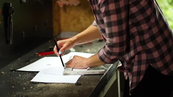 Female interior designer working on drawings, woman architect draws