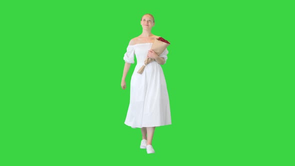 Dreamy Young Girl with Beautiful Bouquet Walking on a Green Screen Chroma Key