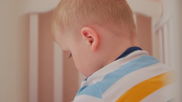 Boy Playing In Bed Closeup